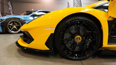 Close-up of shiny car accessories in black and yellow colors.