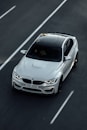 white bmw m 3 on road