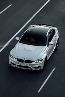 white bmw m 3 on road