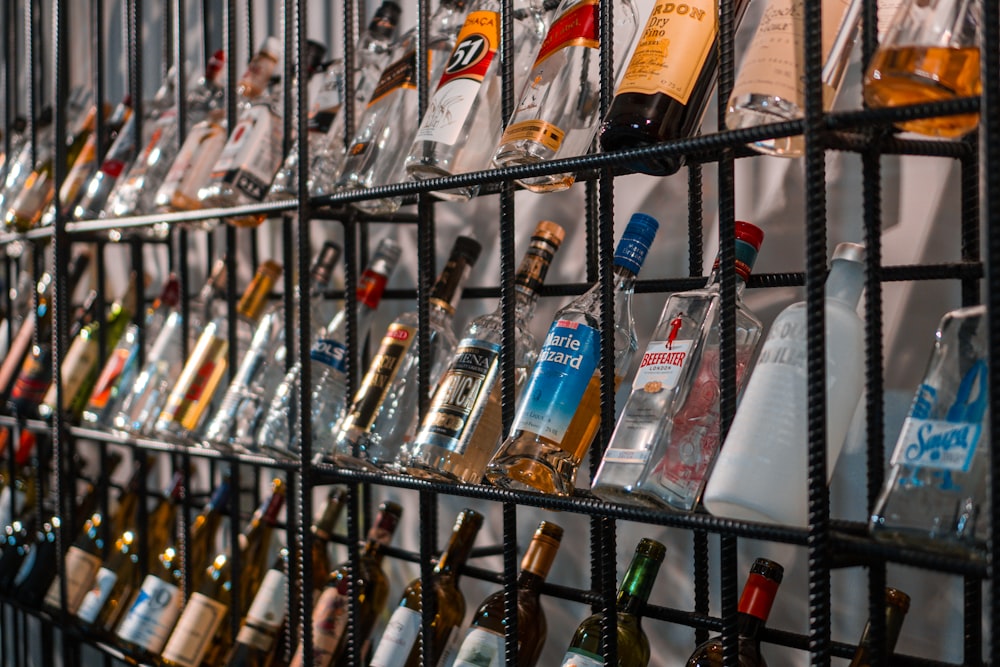 assorted bottles on glass shelf