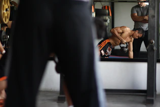man in black and orange shorts