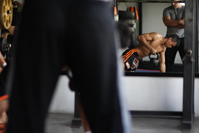 man in black and orange shorts