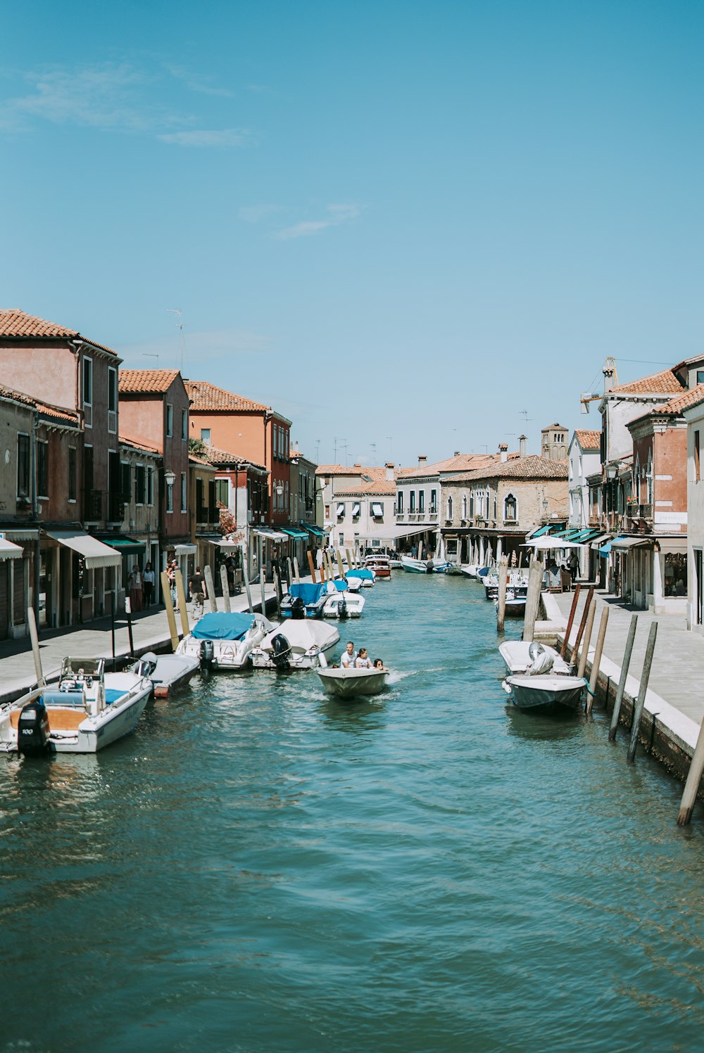 boat on water near buildings during daytime