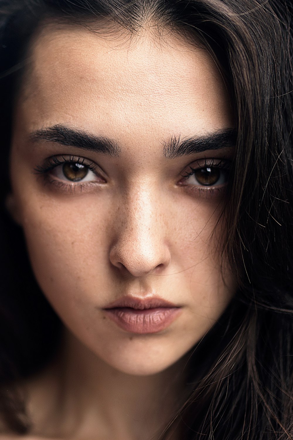 womans face with black hair