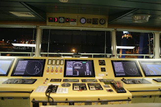 Modern ship bridge with crew managing navigation and operations.