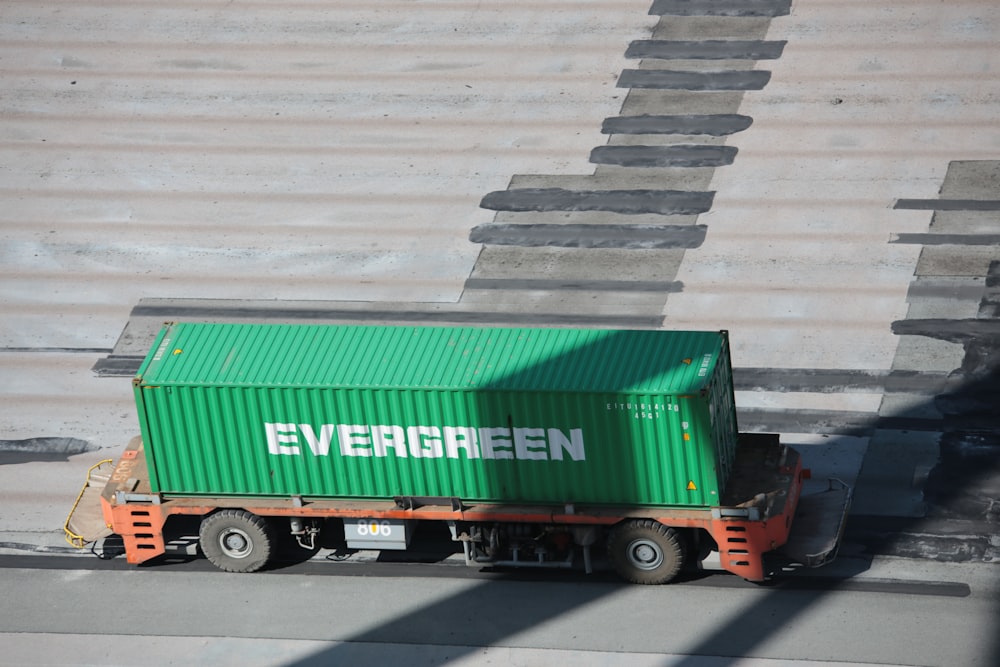 green and red freight truck