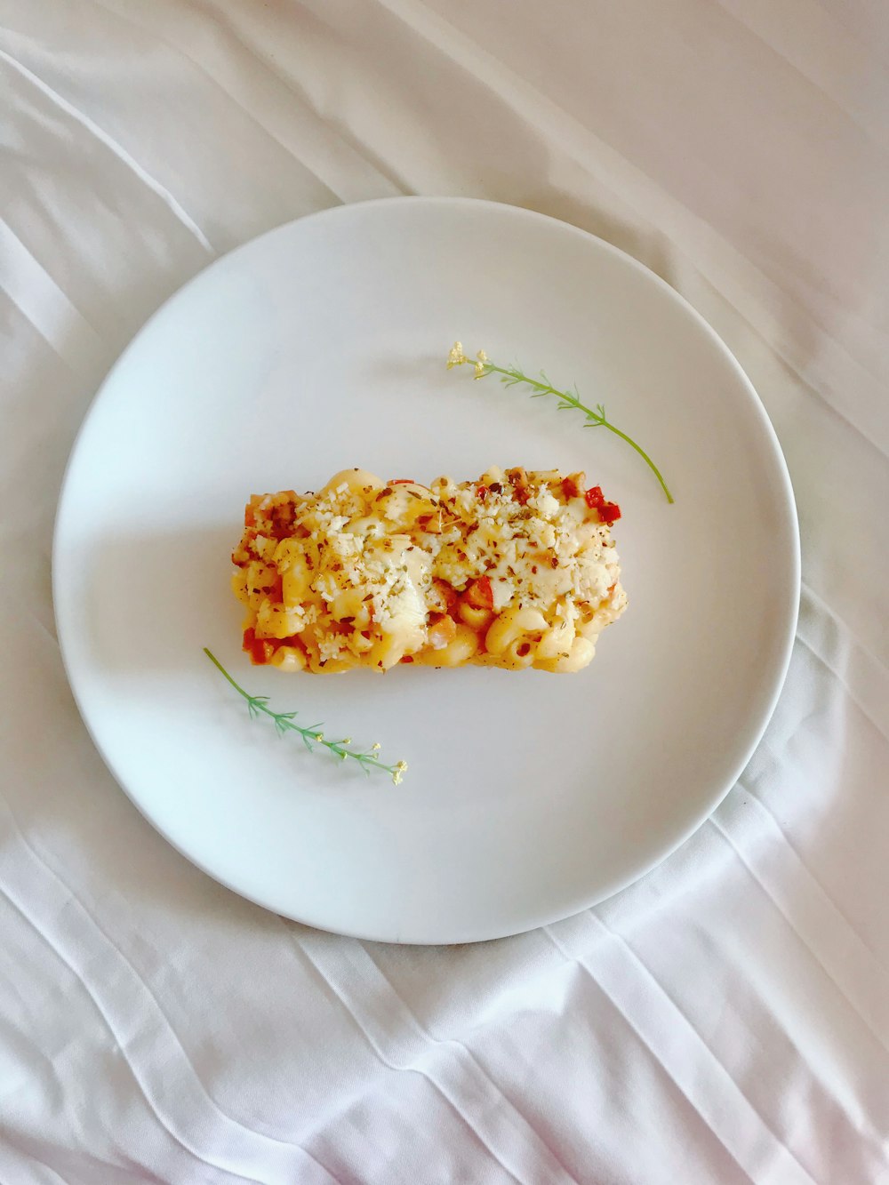 white ceramic plate with rice and green leaf vegetable