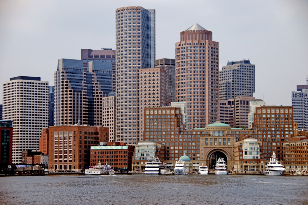 city skyline across body of water during daytime