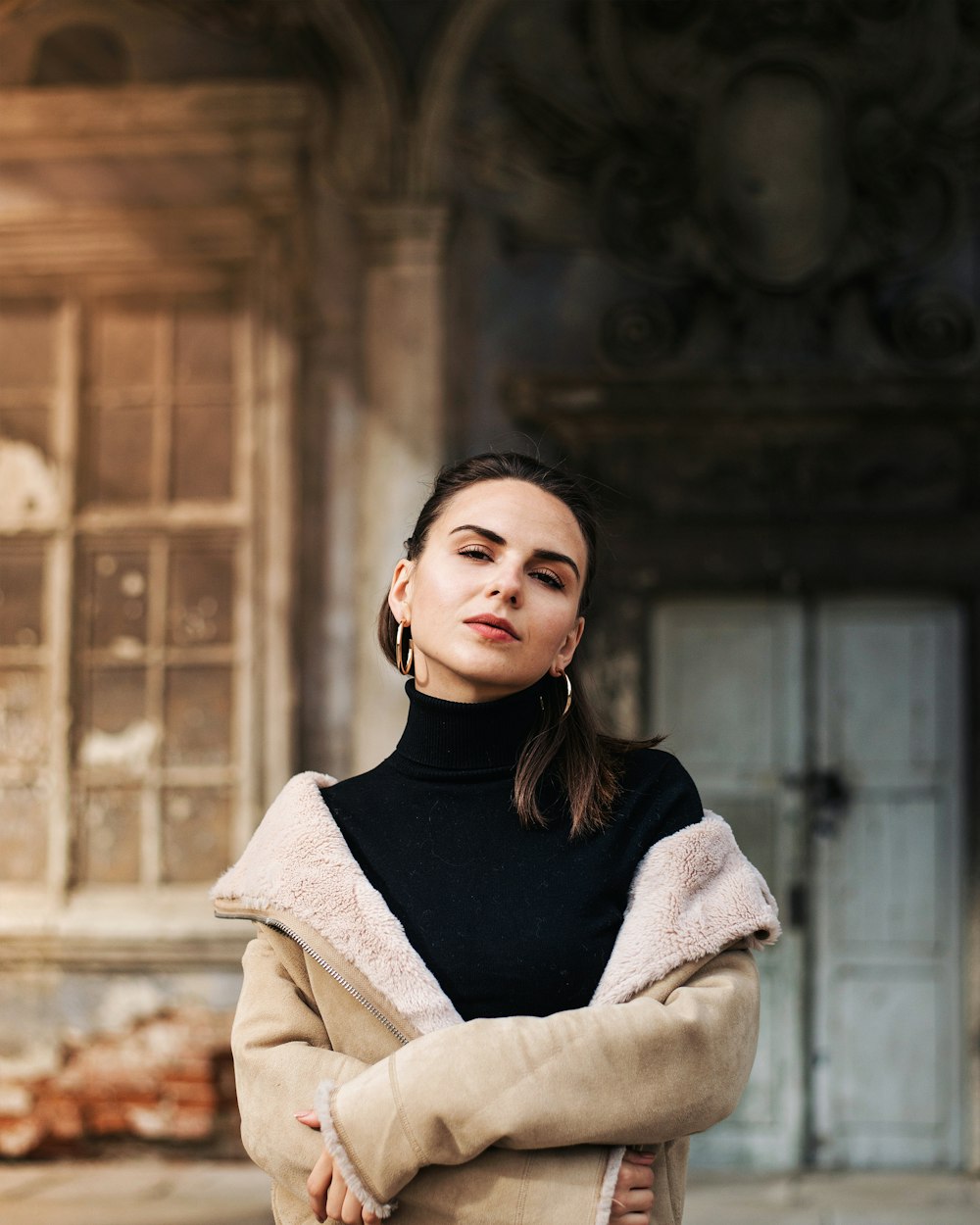 woman in black turtleneck sweater and beige coat