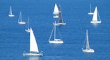 white sailboat on blue sea during daytime