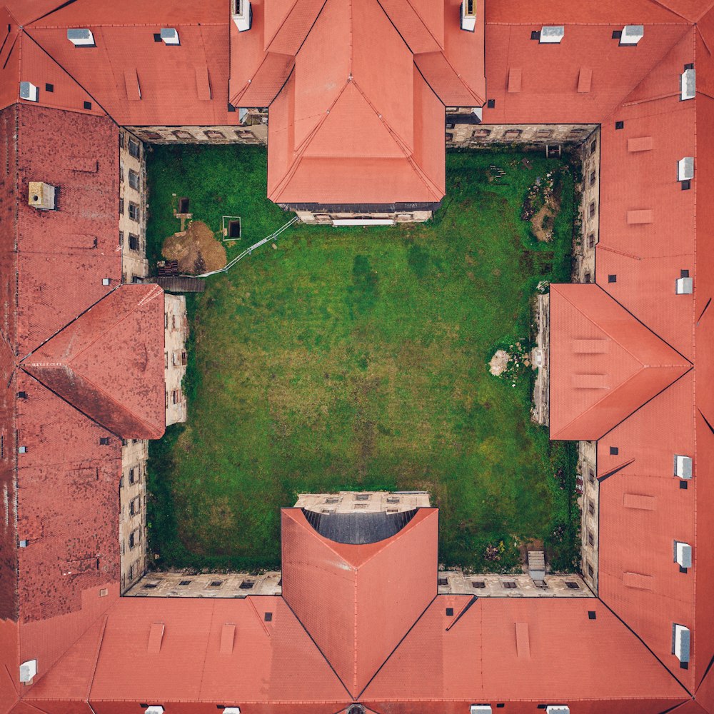 aerial view of green trees and brown brick building