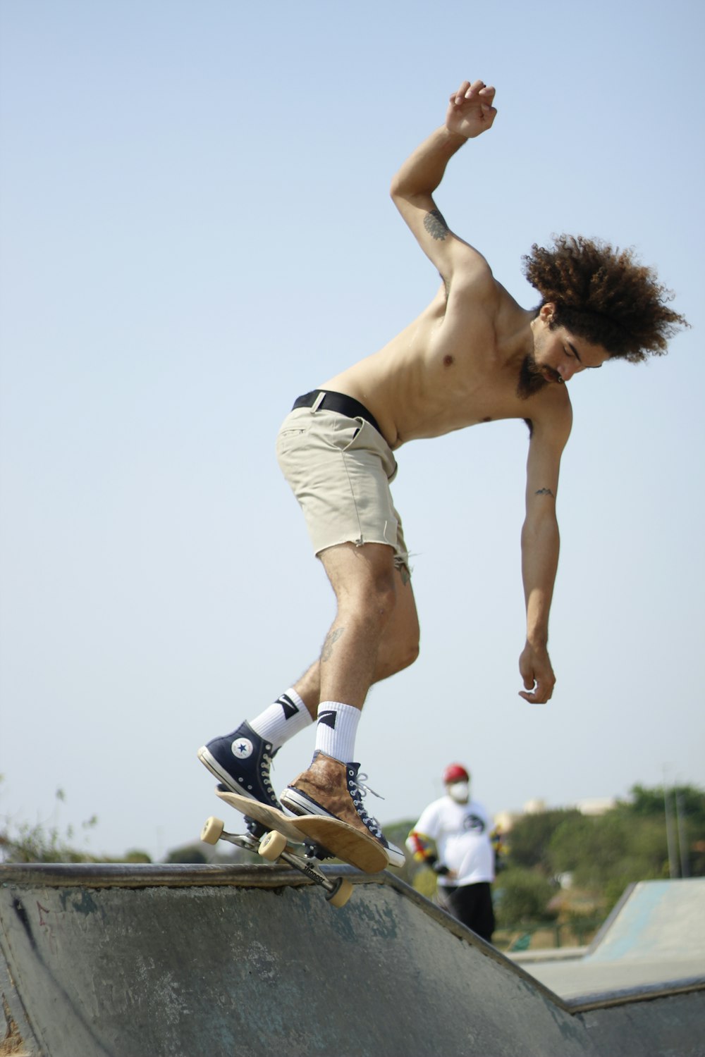 woman in white shorts and blue and white nike sneakers