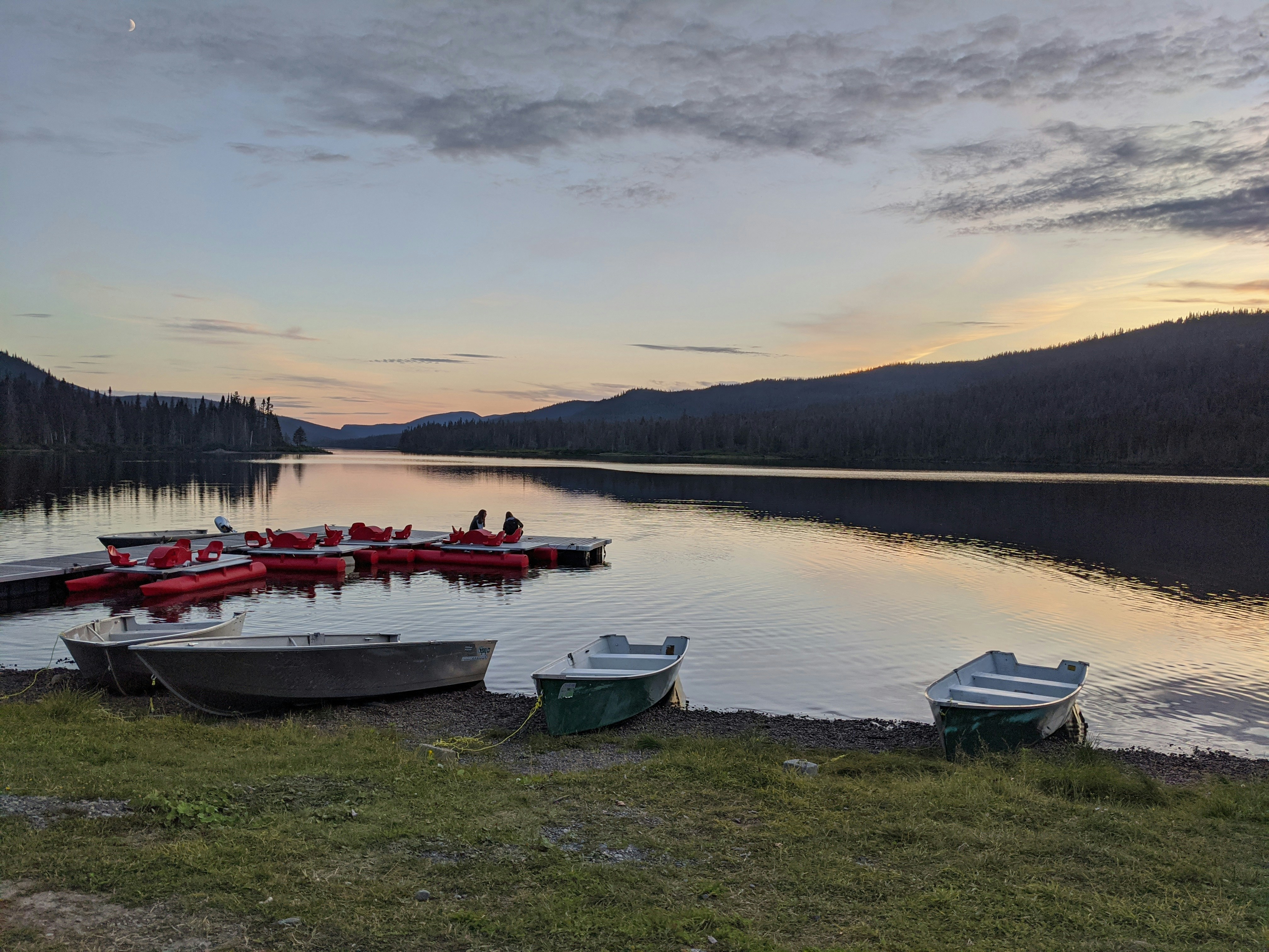 white and red boat on body of water during daytime