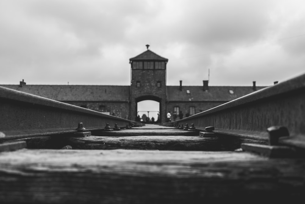 grayscale photo of concrete bridge