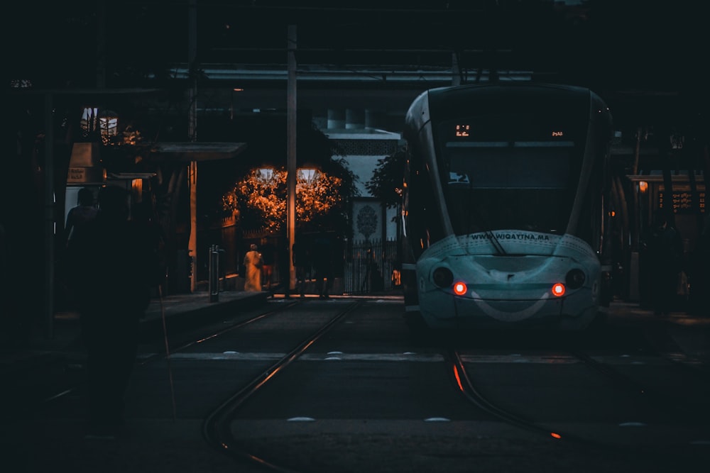 black car on road during night time