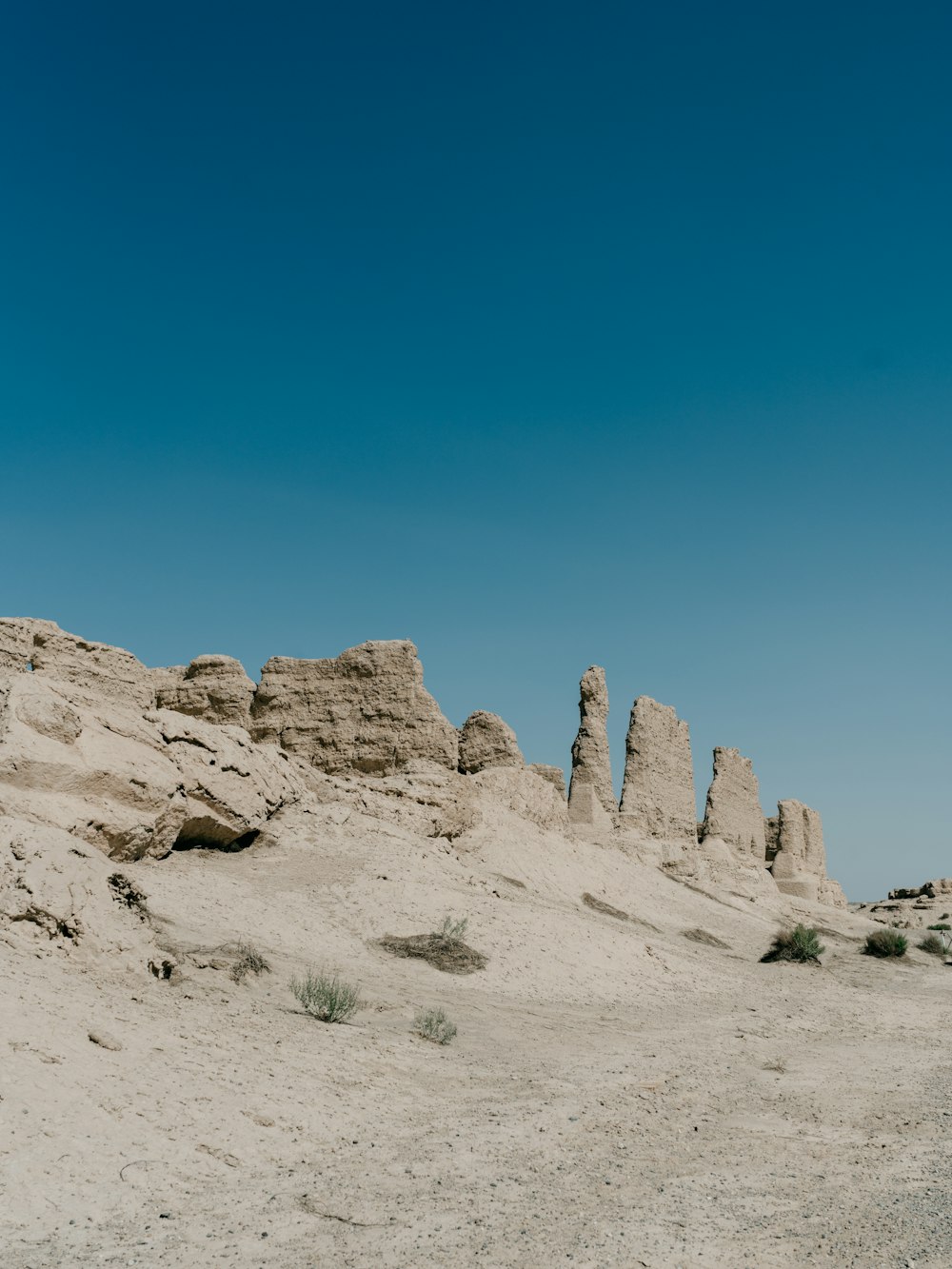 brown rock formation under blue sky during daytime