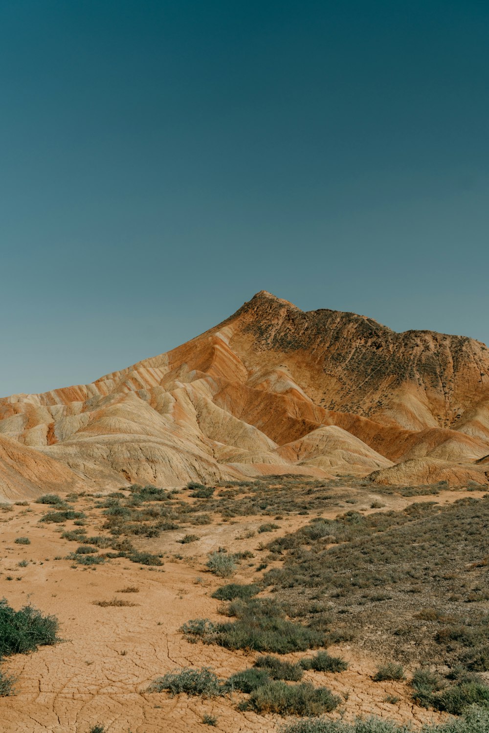 brown rocky mountain under blue sky during daytime