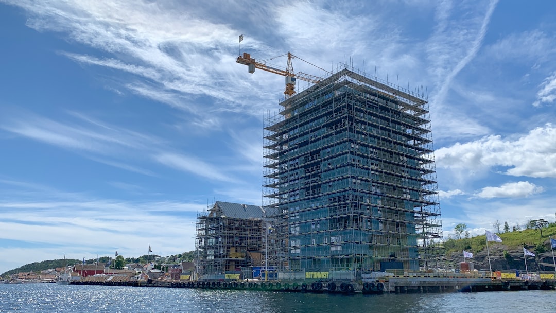 gray concrete building near body of water during daytime