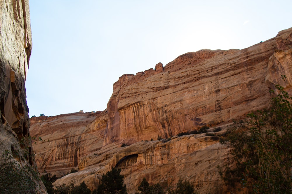 brown rock formation under white sky during daytime