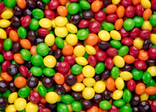 yellow red and green round fruits