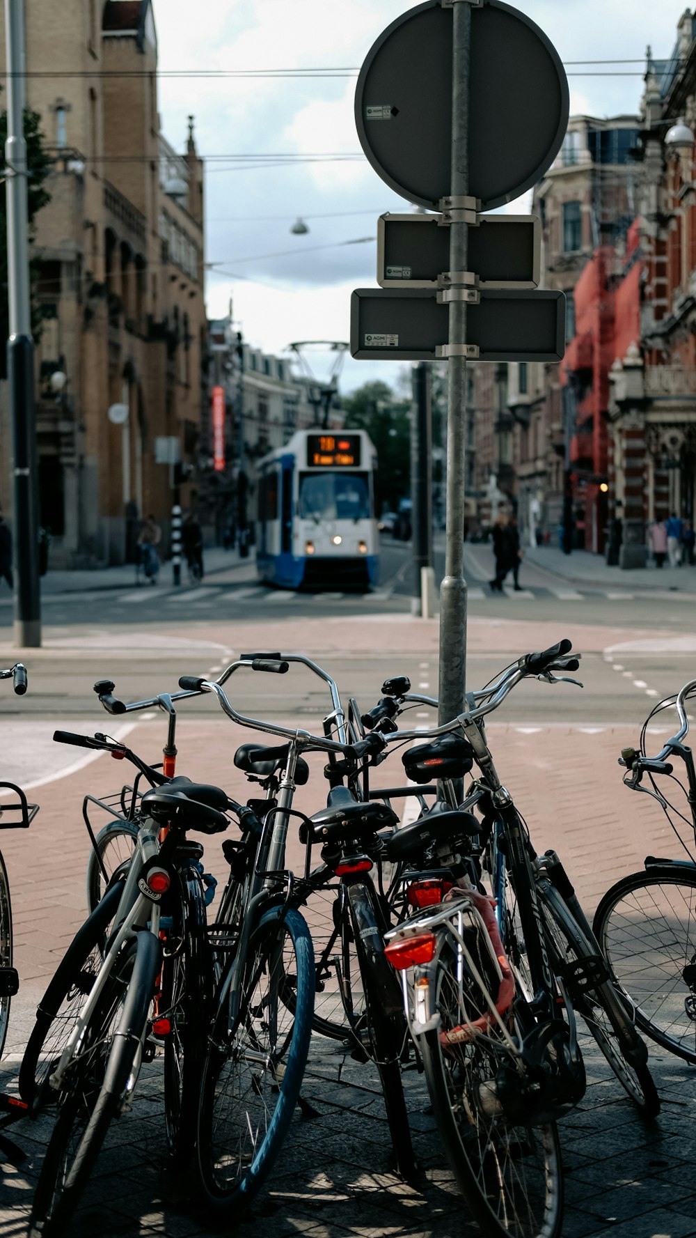 black bicycle parked on sidewalk during daytime