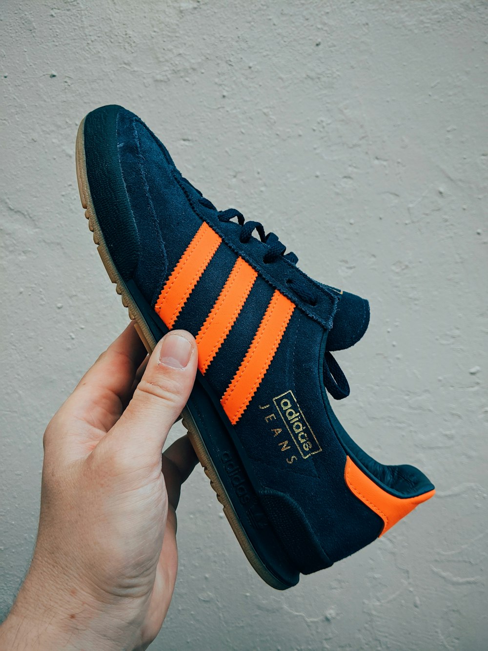 black and orange adidas athletic shoe