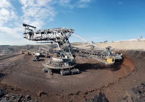 white and black airplane on brown sand during daytime