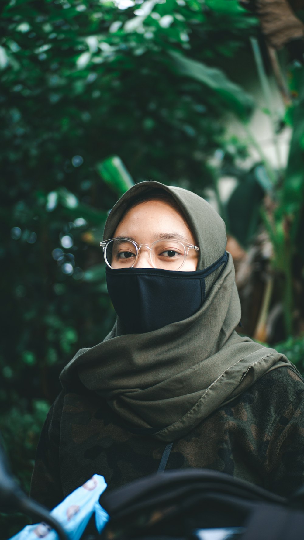 woman in black hijab and black framed eyeglasses