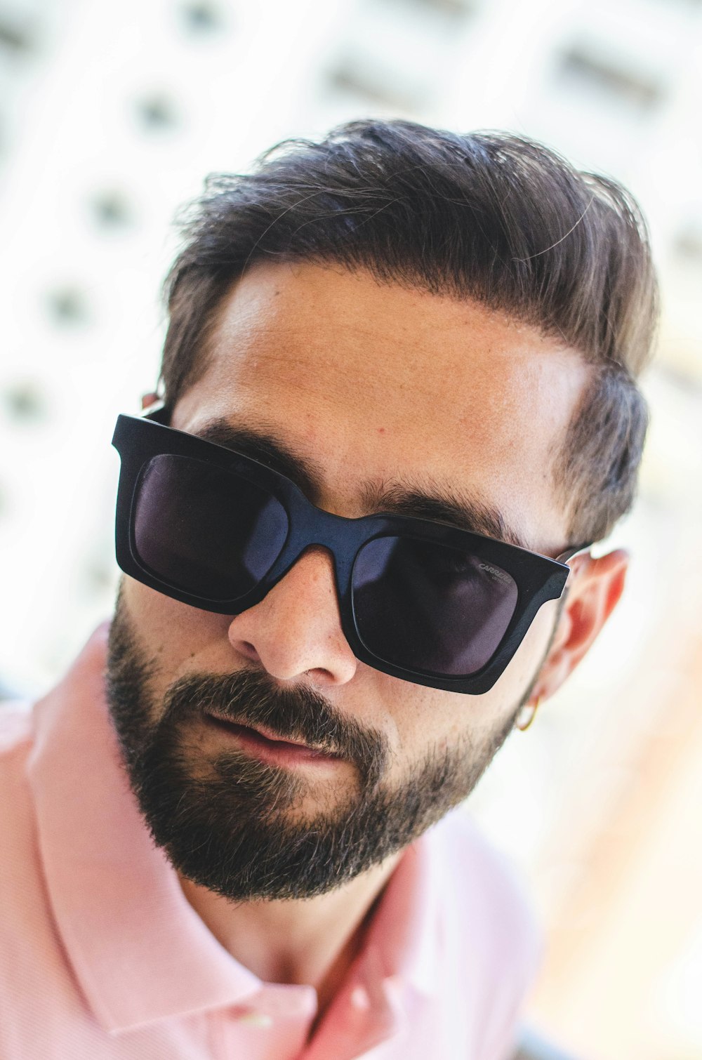 man in black sunglasses and white shirt