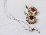 silver and brown gemstone pendant necklace