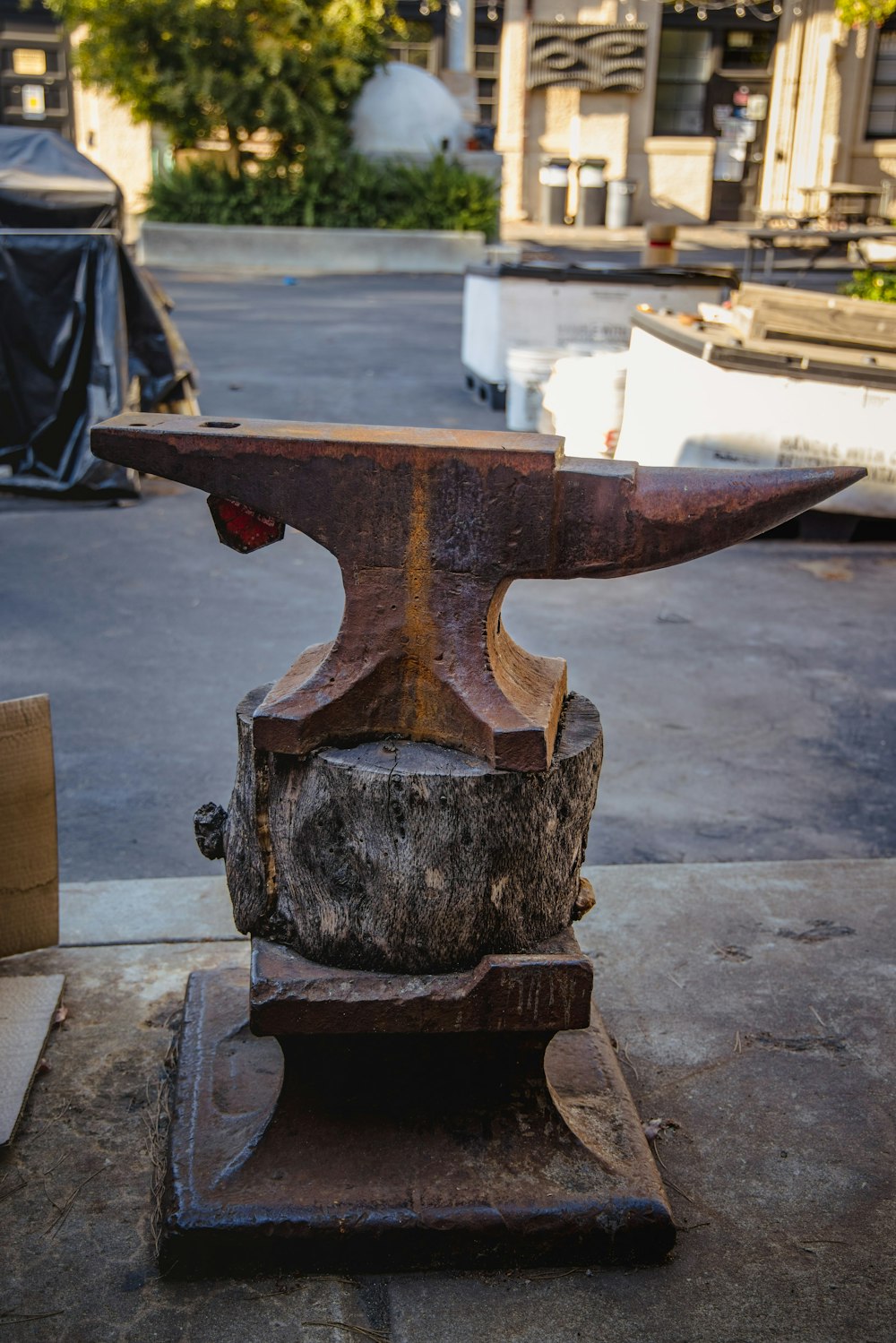 brown wooden table on gray concrete floor