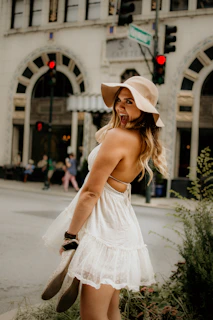 Happy customer walking confidently in British Shoes on a city street with red, white, and blue accents in the background.