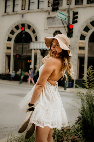 Happy customer walking confidently in British Shoes on a city street with red, white, and blue accents in the background.