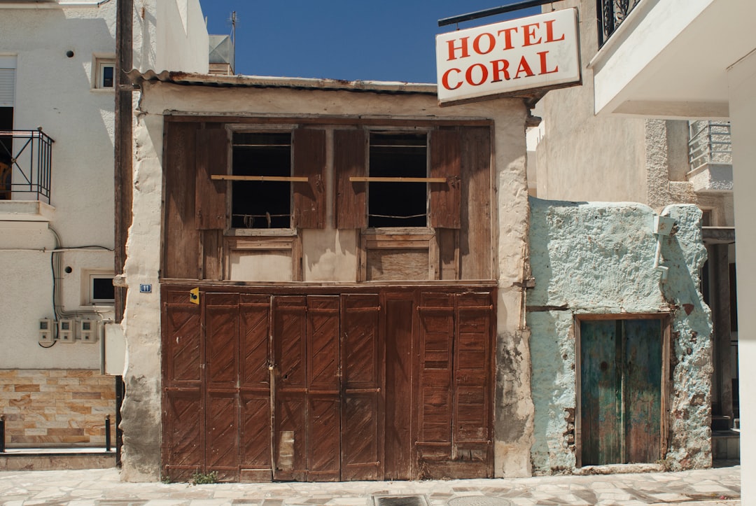 brown wooden door closed during daytime