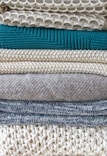 Stack of assorted wool socks showcasing texture and quality