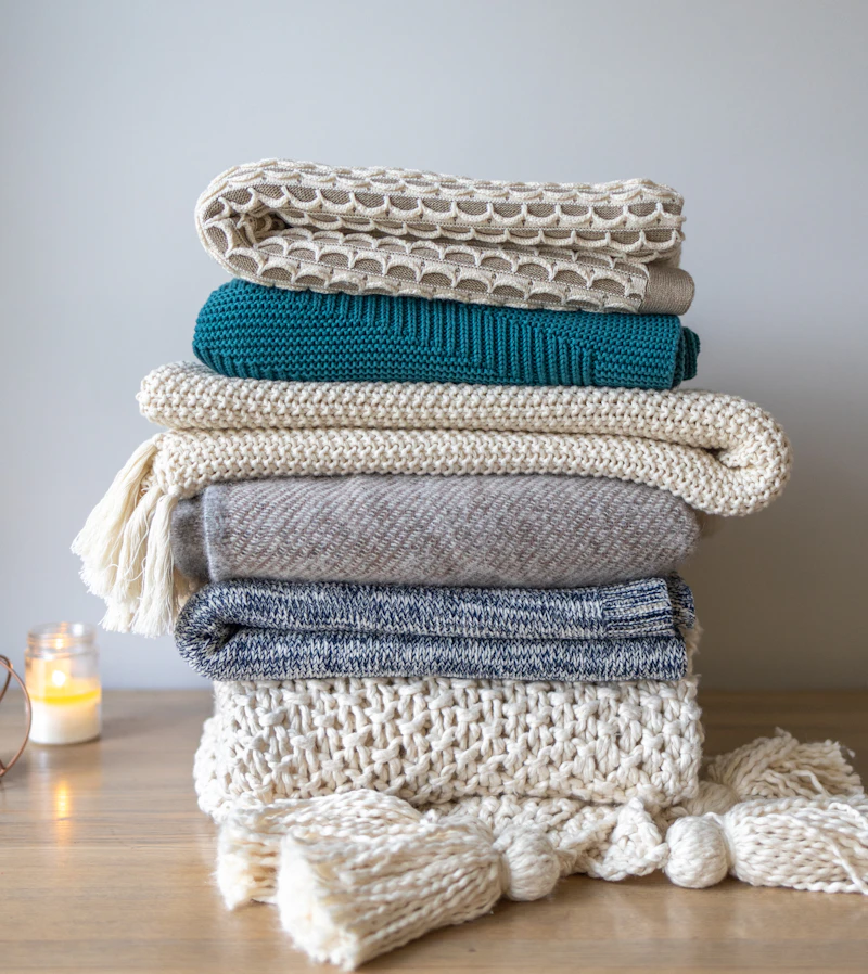 Hand-knit wool throw blanket in cream