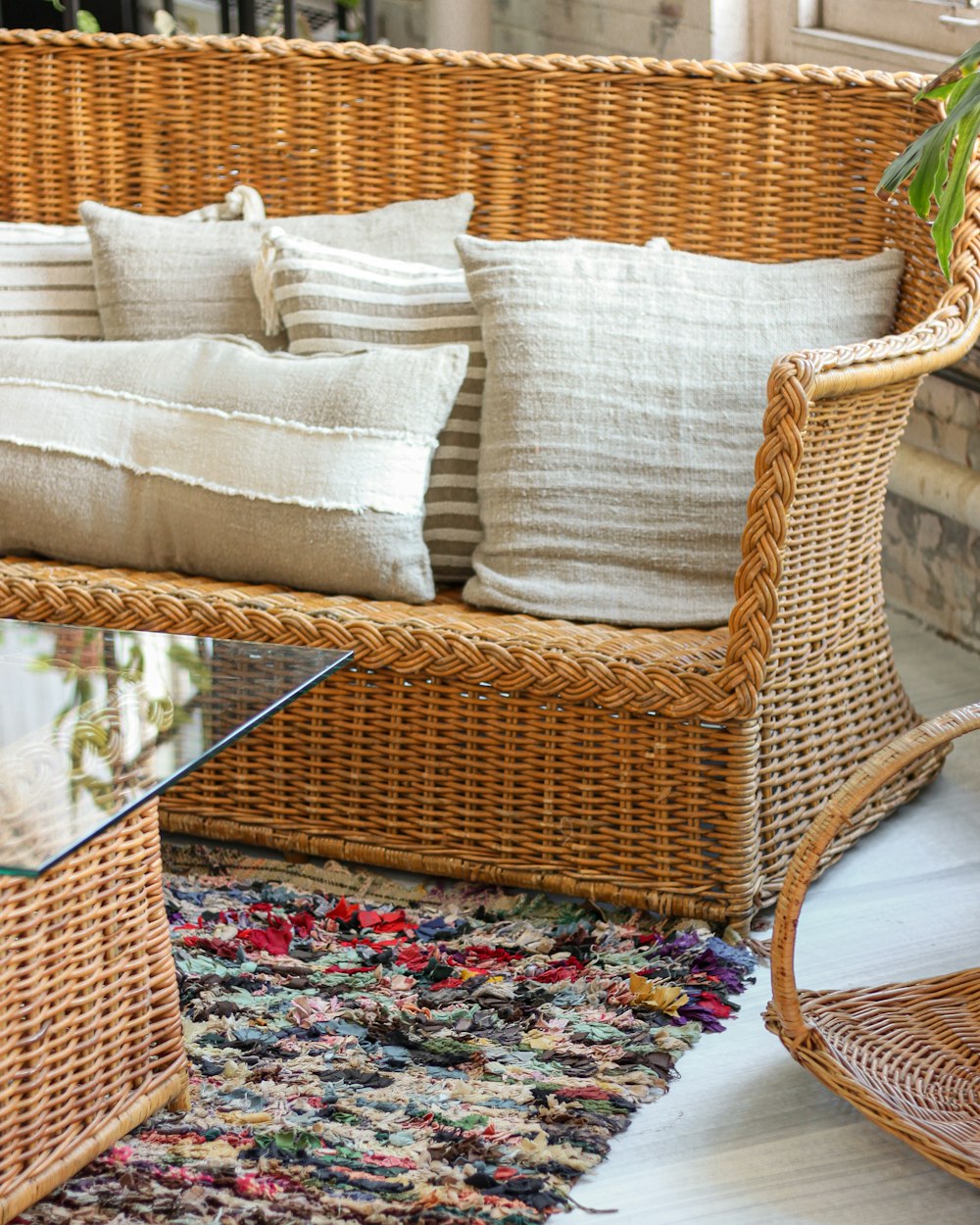 brown wicker framed glass top coffee table