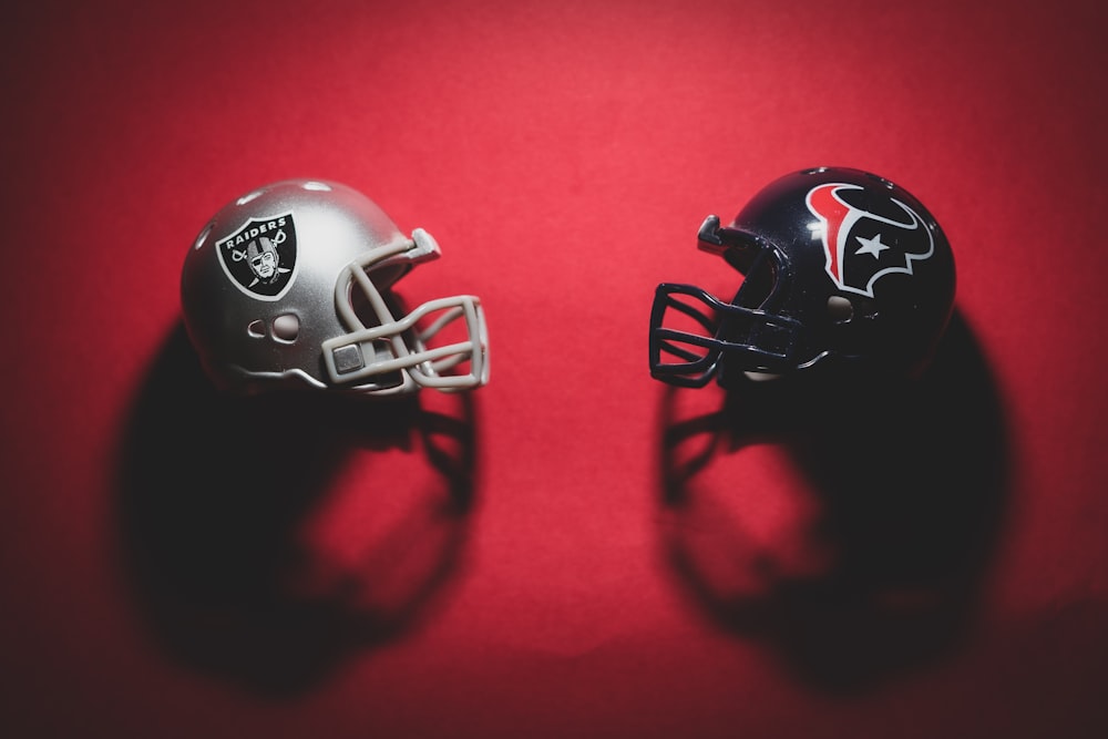 black and red helmet on red textile