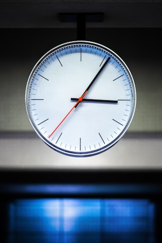 white analog watch at 10