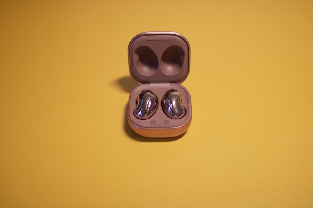 brown and black sunglasses on yellow table