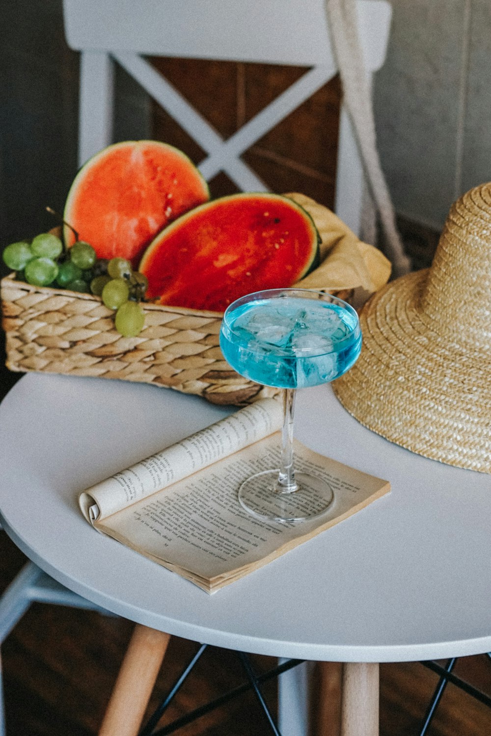 blue and clear glass bowl on white paper