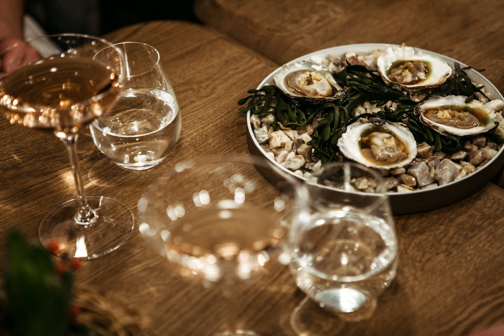 clear drinking glass on brown wooden table