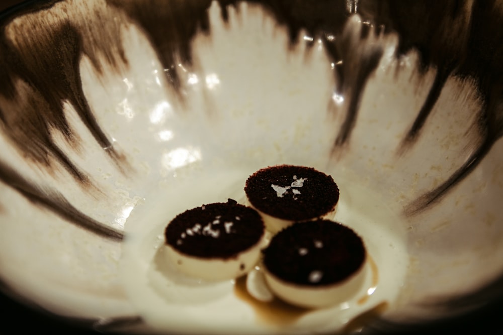 white ceramic plate with black round beads