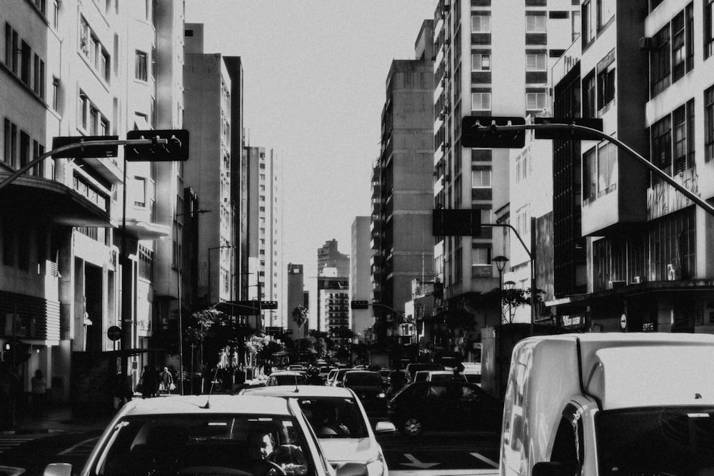 grayscale photo of cars on road