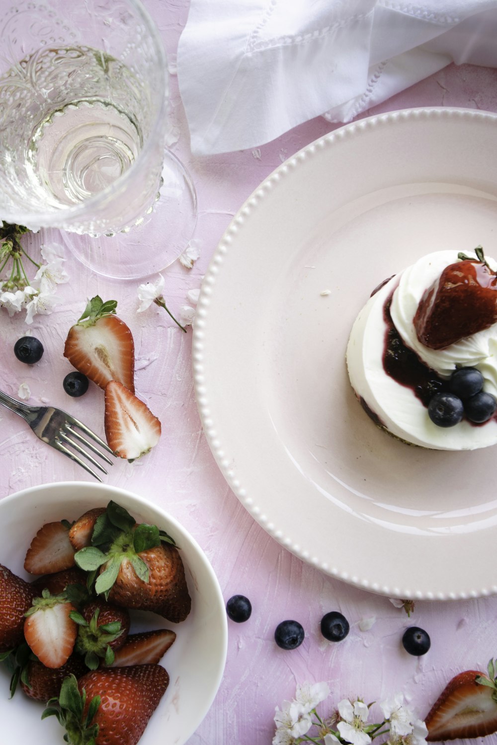 sliced strawberries on white ceramic plate