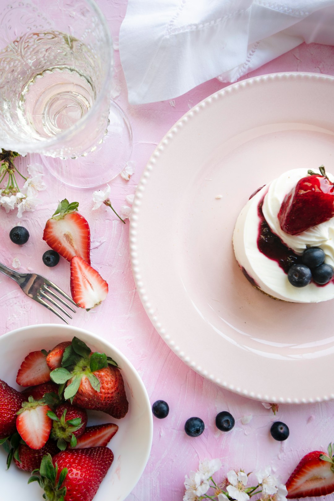 sliced strawberries on white ceramic plate