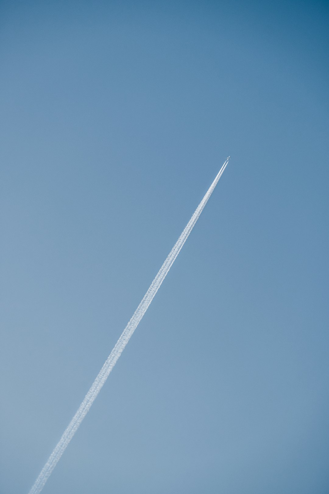 white metal bar under blue sky