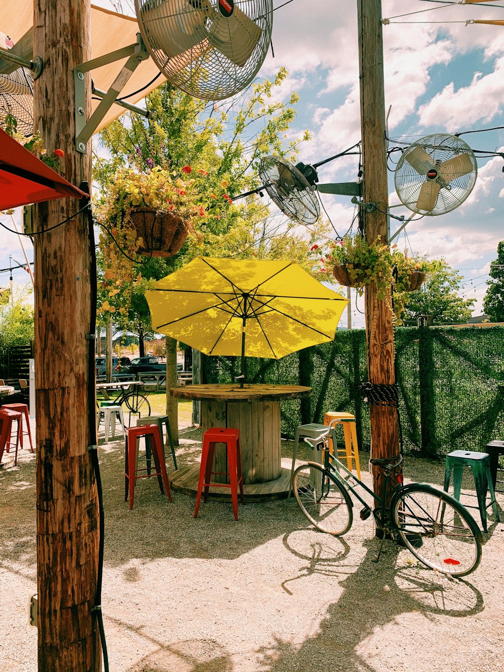 yellow umbrella on brown wooden chair