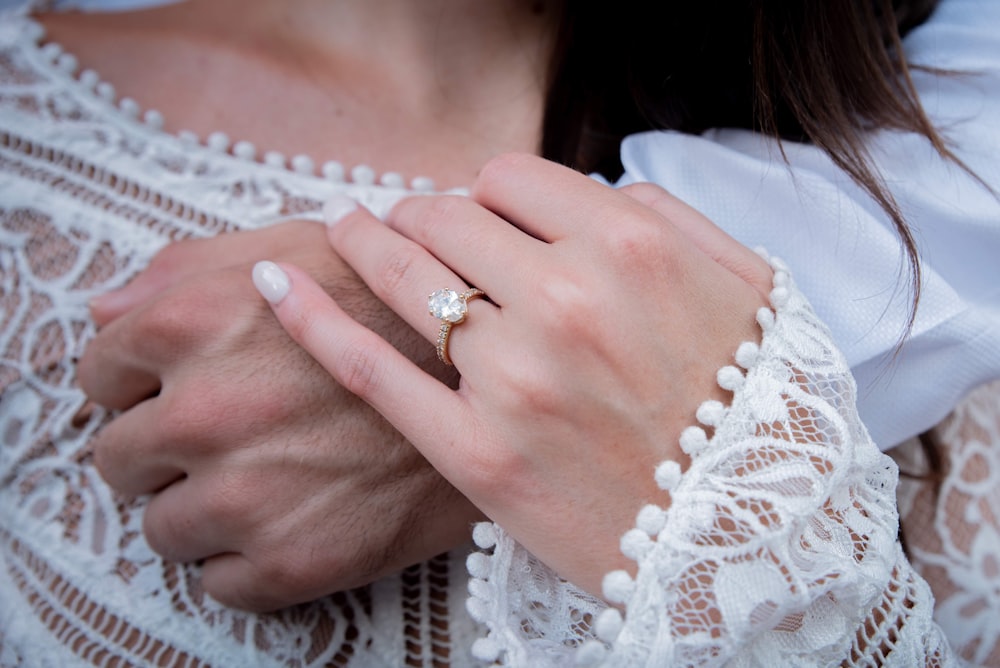 woman wearing gold diamond ring