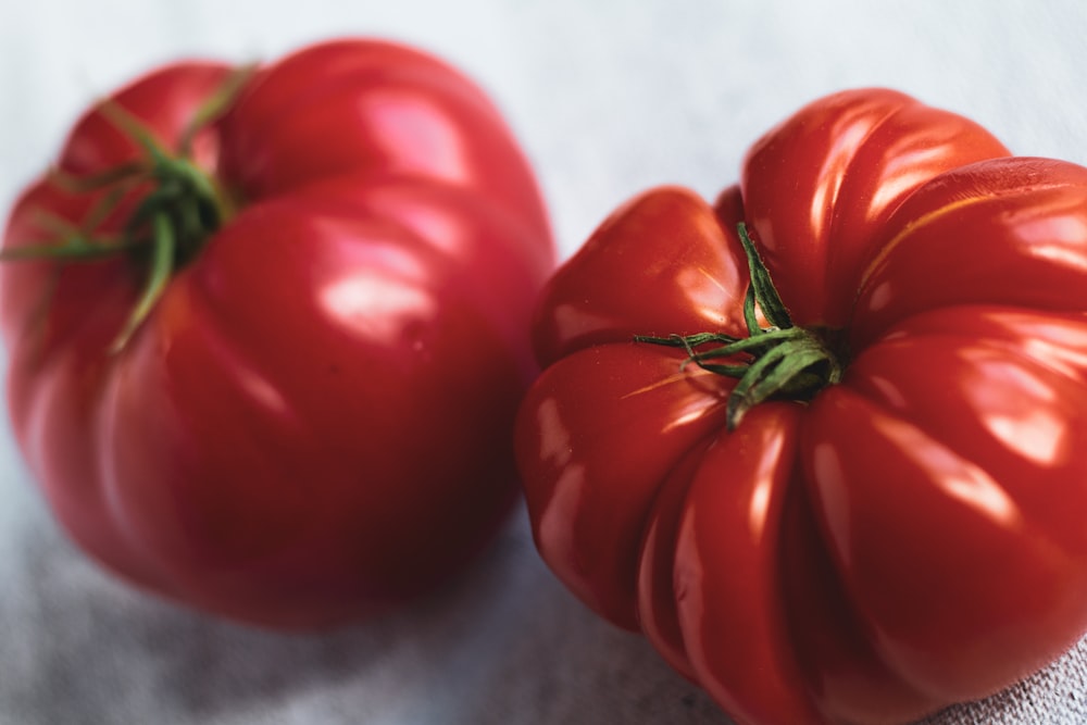 red tomato on gray textile